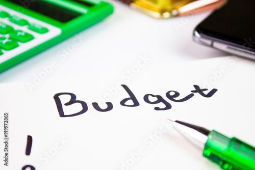 BUDGET is a word written in marker on a pad of paper with a calculator and a pen and a notebook. Budgeting, financial and economic plan, budget planning, financial concept.