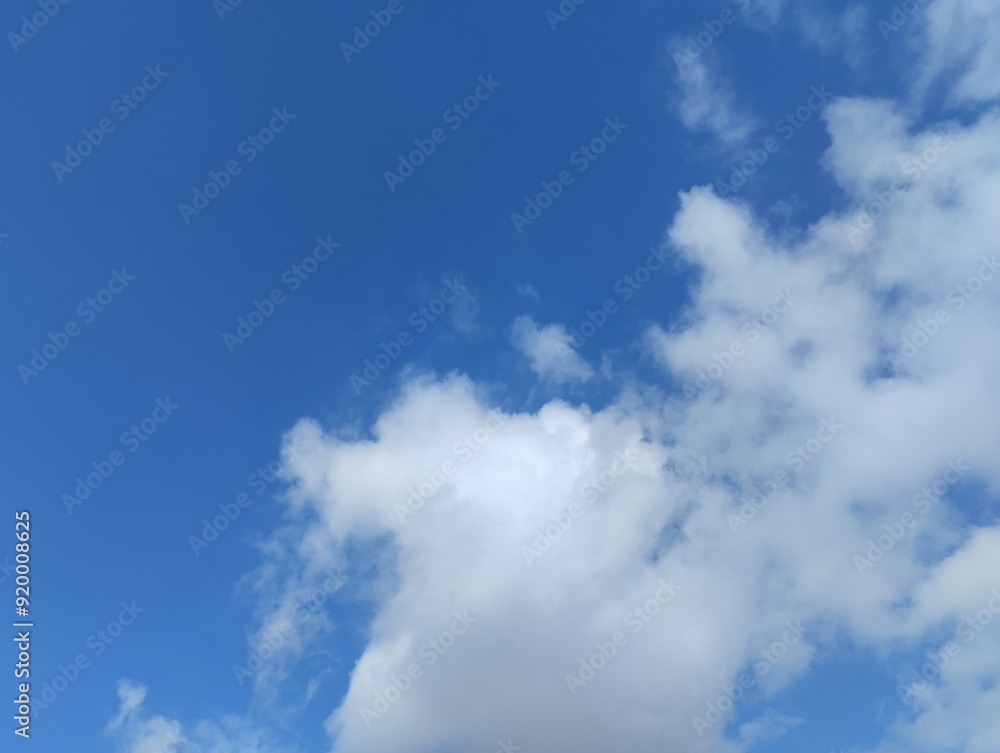 Fototapeta premium White clouds and blue sky. The view of the clouds and sky is clear and calming 