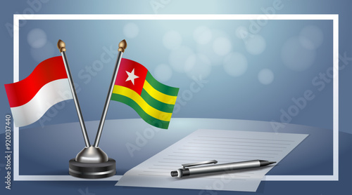 Indonesia and  Togo Small national flag on bokeh background, cooperative relationship