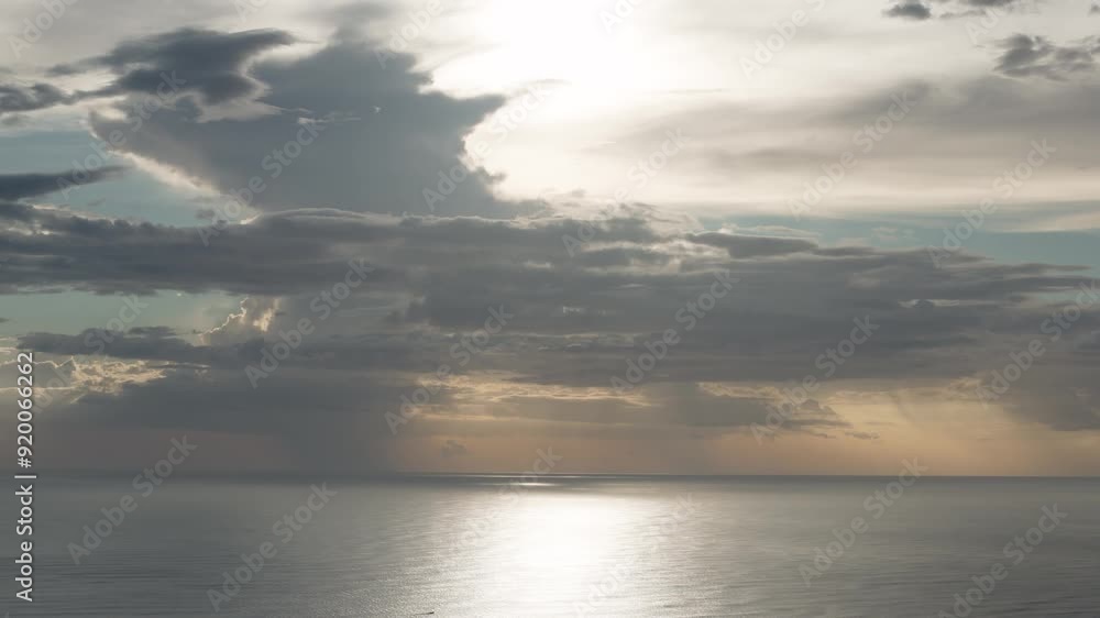 Ocean landscape with big fluffy clouds on golden sunset hour Ocean landscape with big fluffy clouds on golden sunset hour