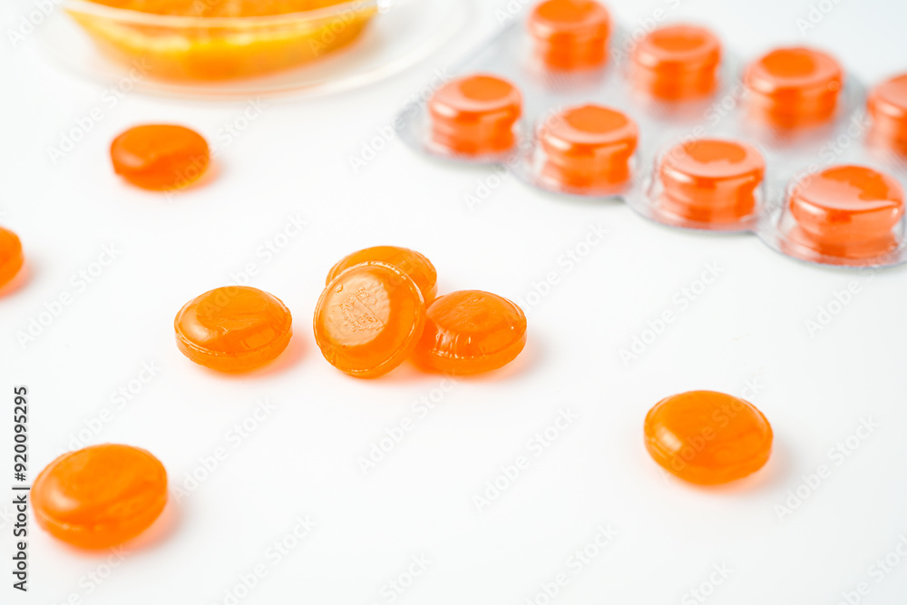 Medical lozenges for relief cough, sore throat and throat irritation isolated on white background Medical lozenges for relief cough, sore throat and throat irritation isolated on white background