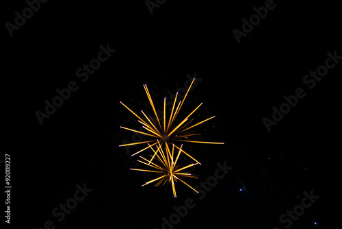 Fireworks on the dark sky background. Colorful fireworks from Loto Quebec in Quebec, Canada. Abstract colored firework background with free space for text. fireworks light up the night sky