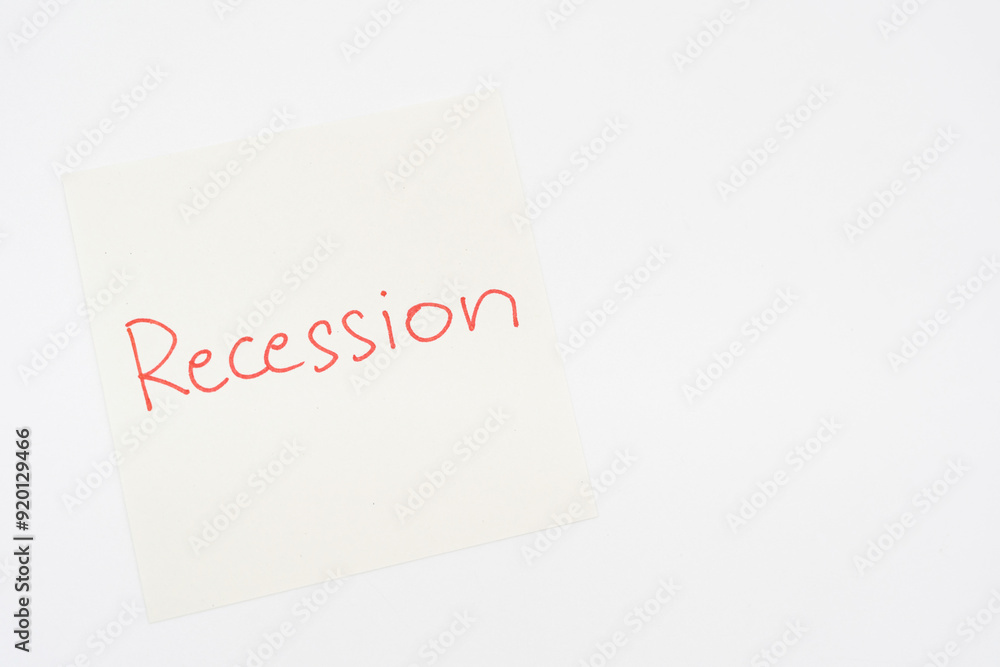Hand writing Recession on paper note. Global economic crisis. Recession business and stock crisis concept. Hand writing Recession on paper note. Global economic crisis. Recession business and stock crisis concept.
