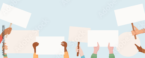 Diverse hands hold protest signs and placards. People from the community come together, raising their hand with blank banners high in a unified demonstration of solidarity and strength.