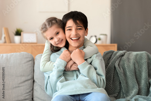 Little girl hugging her bro...