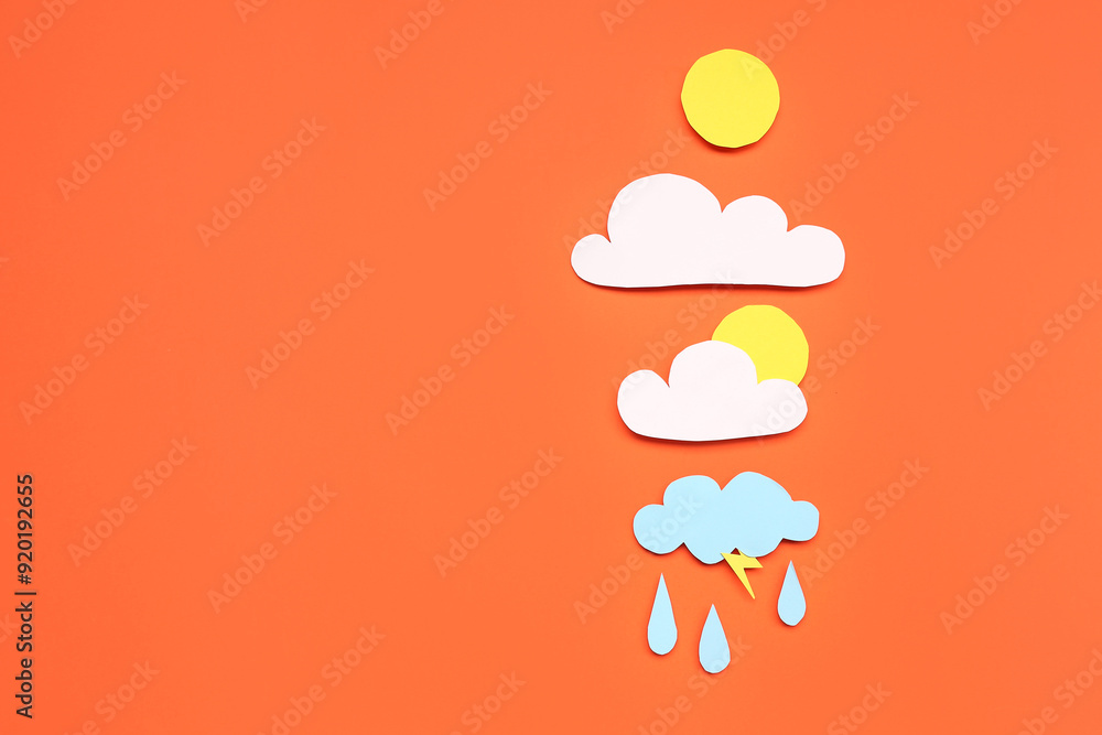 Paper sun with clouds and rain drops on red background. Weather forecast concept Paper sun with clouds and rain drops on red background. Weather forecast concept