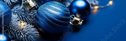 Blue Christmas Delight: Vibrant Blue Holiday Ornaments on a Blue Background, Celebrating the Season with Festive Greetings and Joy