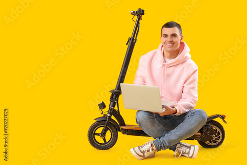 Young man with electric sco...