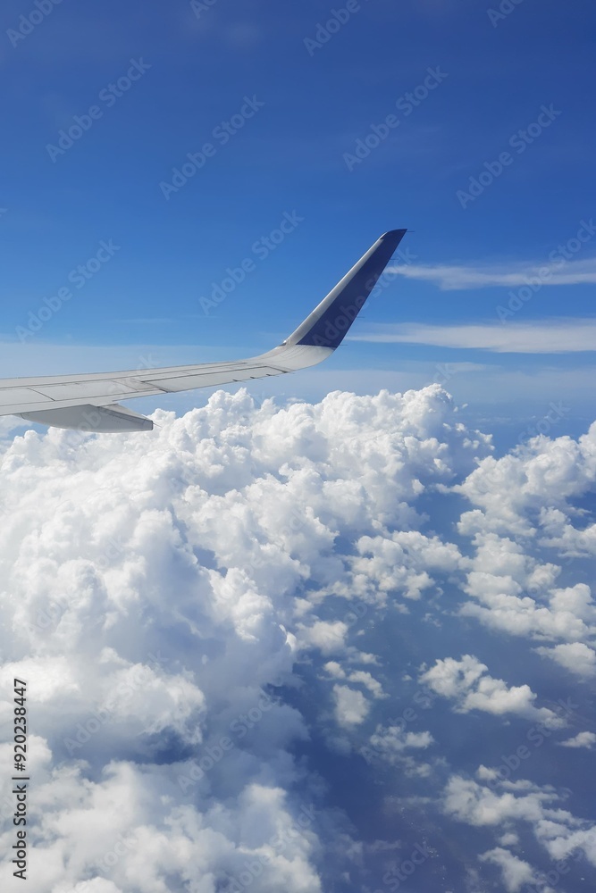 Obraz premium Beautiful view blue sky and white clouds from the airplane | Window seat passenger view 
