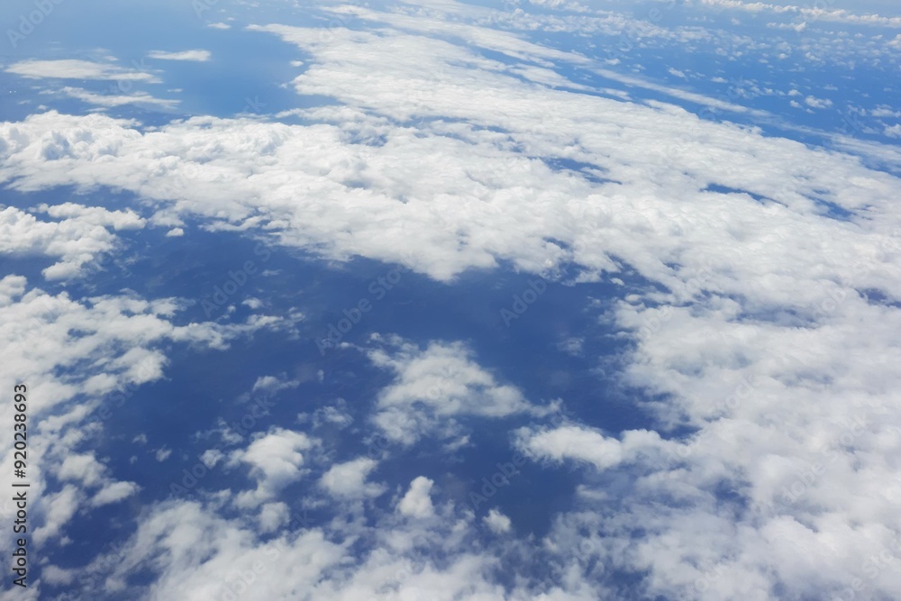 Beautiful view blue sky and white clouds from the airplane | Window seat passenger view Beautiful view blue sky and white clouds from the airplane | Window seat passenger view