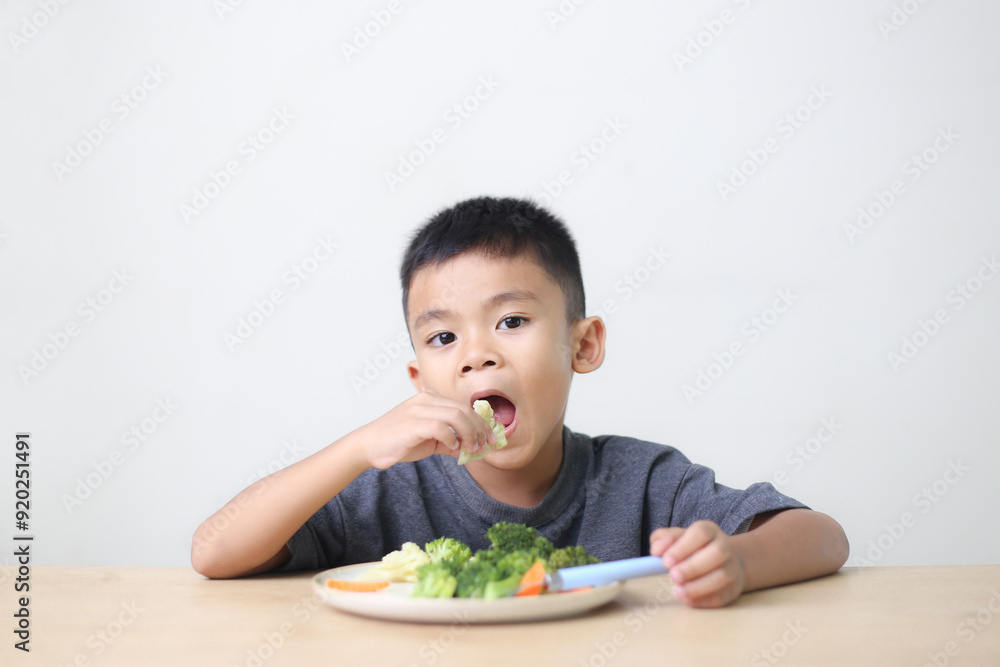 Nutrition healthy eating habits for kids concept. Children do not like to eat vegetables. Little cute boy refuses to eat healthy vegetables. Nutrition healthy eating habits for kids concept. Children do not like to eat vegetables. Little cute boy refuses to eat healthy vegetables.