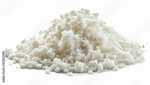 Piled white granular substance on a plain background