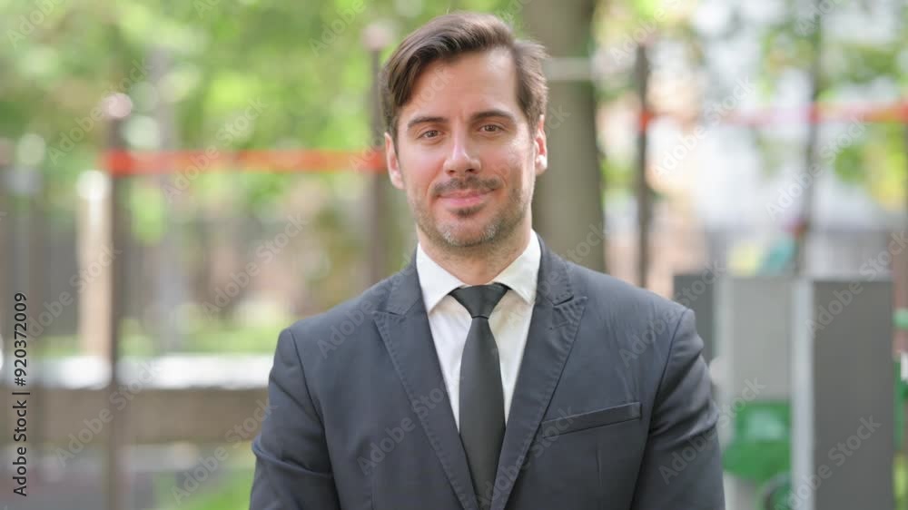 Portrait of Young Businessman with Thumbs Down Outdoor Portrait of Young Businessman with Thumbs Down Outdoor