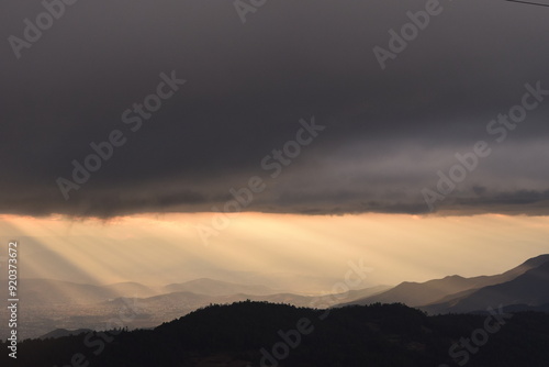 View of sunset light in cloudy sky over mountains Oaxaca, Mexico