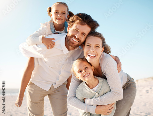 Portrait, beach and family with love, hug and happiness with kids, parents and travel for vacation. Face, seaside and mother with father, children and summer holiday with embrace, adventure and smile