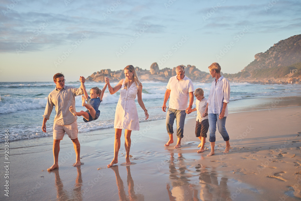 © Alex Shared/peopleimages.com - Holding hands, ocean and big family with vacation, happiness and travel for adventure, fun and play. Generations, beach and grandparents with mother, father and kids with childhood, smile and journey