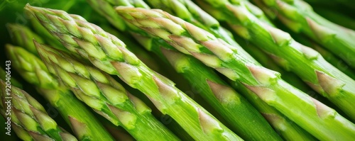 Detailed macro shot of asparagus spears, focusing on the rich green hue and delicate surface patterns, close-up