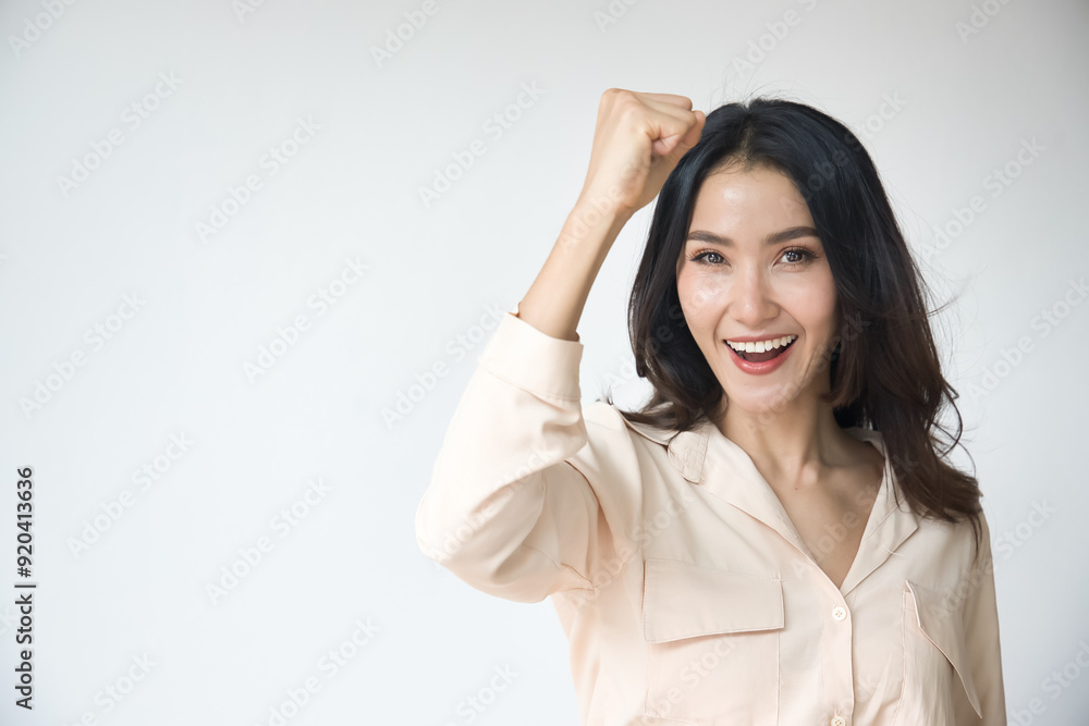 Strong Successful Confident and Determined Asian woman posing positive arm up pose with confidence and laugh Strong Successful Confident and Determined Asian woman posing positive arm up pose with confidence and laugh