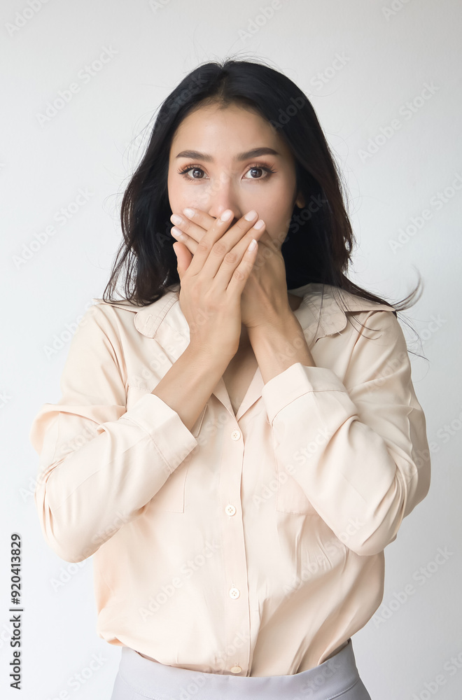 Fearful and speehless Asian woman covers her mouth, South Asian woman can not speak freely due to censorship, no free speech, no freedom of speech concept Fearful and speehless Asian woman covers her mouth, South Asian woman can not speak freely due to censorship, no free speech, no freedom of speech concept