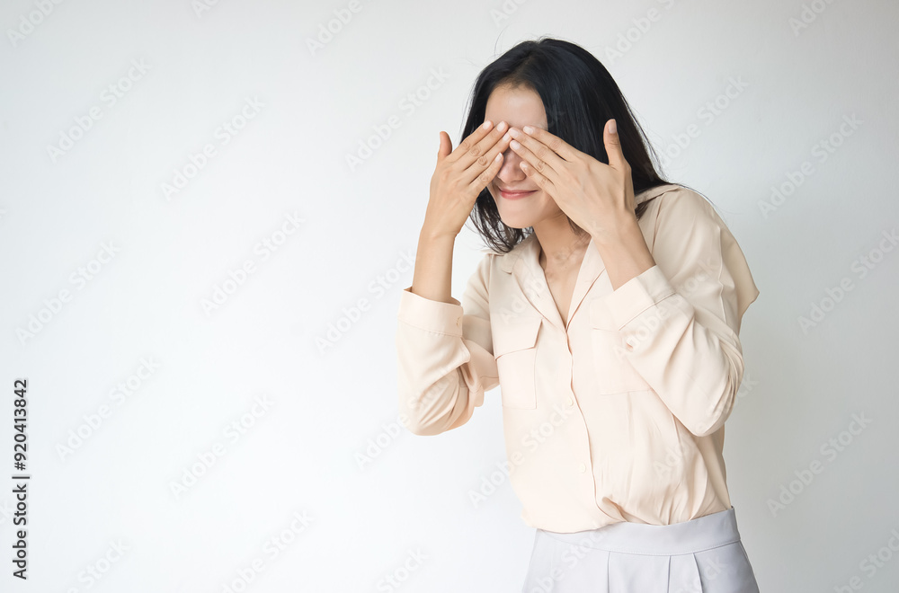 Fearful and speehless Asian woman covers her eyes, South Asian woman can not see or look freely due to censorship, no free speech, no freedom of information concept Fearful and speehless Asian woman covers her eyes, South Asian woman can not see or look freely due to censorship, no free speech, no freedom of information concept