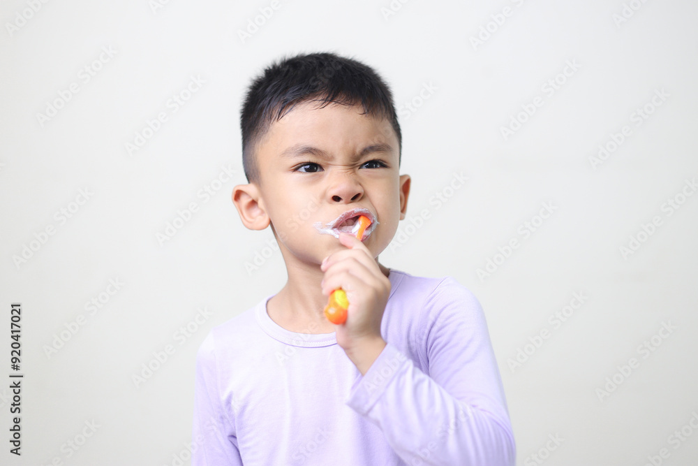 child Asia kid boy brushing teeth isolated on white backgroud. child Asia kid boy brushing teeth isolated on white backgroud.