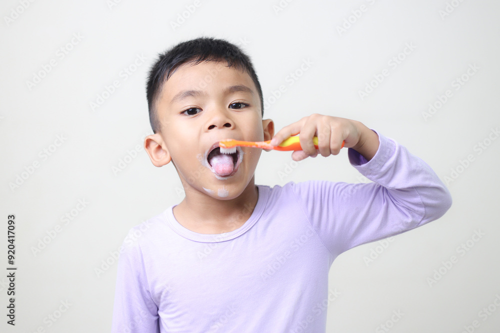 child Asia kid boy brushing teeth isolated on white backgroud. child Asia kid boy brushing teeth isolated on white backgroud.