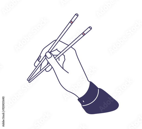 Hand holding chopsticks. Asian cuisine and culture, proper way using wooden s...
