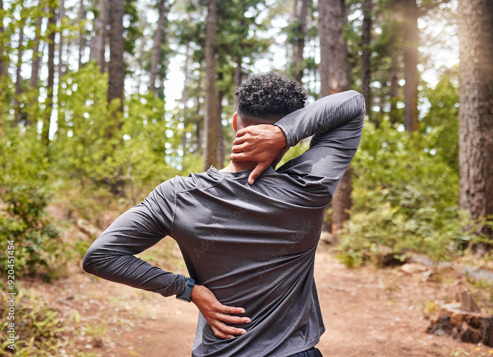 Back pain, fitness and runner man in forest with injury from cardio exercise, marathon or training. Accident, anatomy and emergency with athlete or sports person outdoor in nature for activity Back pain, fitness and runner man in forest with injury from cardio exercise, marathon or training. Accident, anatomy and emergency with athlete or sports person outdoor in nature for activity