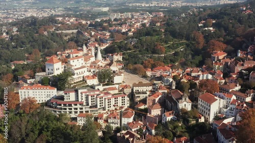 Aerial tracking and tilt shot of the National Palace of Sintra outside of Lisbon, Portugal