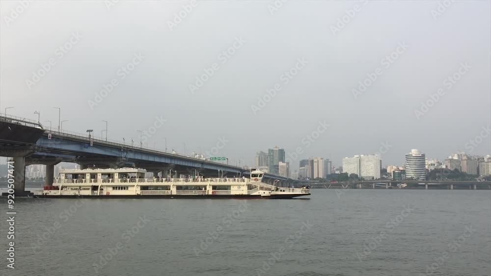 Ship passing under the Bridge in City Skyline Background Ship passing under the Bridge in City Skyline Background