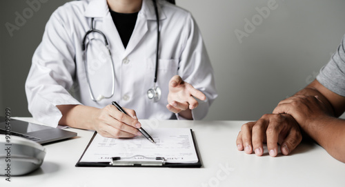Female doctors who treat patients make an appointment to listen to the results after a physical examination and explain medical information and diagnose the disease. Medical concepts and good health