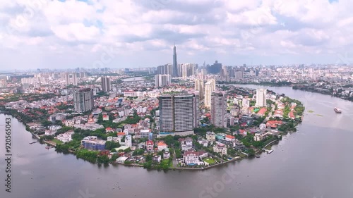 Wallpaper Mural Panoramic view of Saigon, Vietnam from above at Ho Chi Minh City's central business district. Cityscape with Landmark 81 skyscraper and many buildings, local houses, rivers. Torontodigital.ca