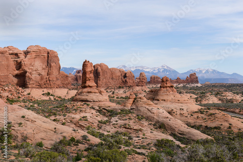 View of Arches National Park with snow-capped mountains in the distance. Utah. USA.