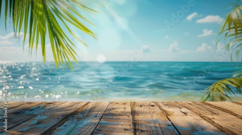 Summer Perspective. Empty Wood Table on Pier by the Sea with Blue Sky and Palm Leaf Bokeh Background photo