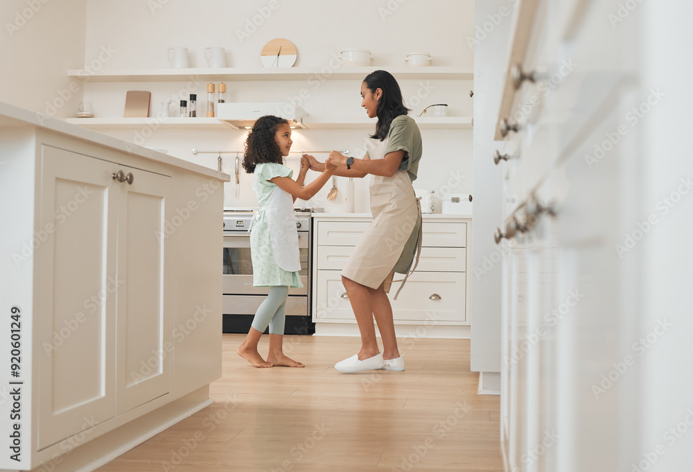 Dancing, baking and mother with child in kitchen for bonding with music, radio or playlist at home. Fun, happy and mom teaching girl kid to groove with song for cooking lunch together at family house Dancing, baking and mother with child in kitchen for bonding with music, radio or playlist at home. Fun, happy and mom teaching girl kid to groove with song for cooking lunch together at family house