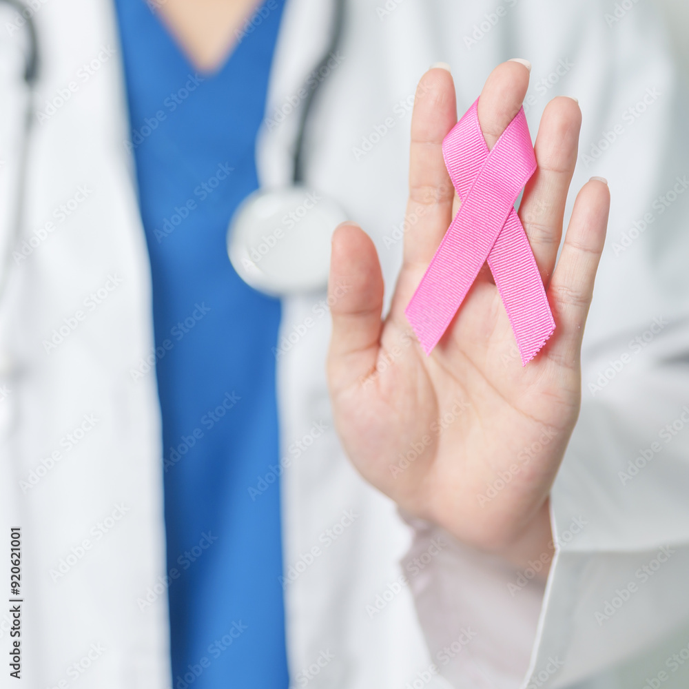 Pink October Breast Cancer Awareness month, woman doctor with pink Ribbon in hospital for support people life and illness. National cancer survivors month, Mother and World cancer day concept Pink October Breast Cancer Awareness month, woman doctor with pink Ribbon in hospital for support people life and illness. National cancer survivors month, Mother and World cancer day concept