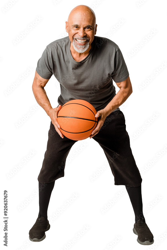 Retired man playing a basketball Retired man playing a basketball