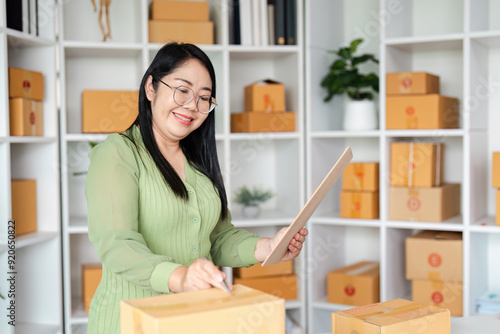 Small Business Owner Organizing Packages in Home Office with Shelves and Boxes