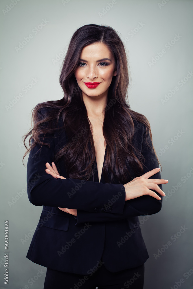 Happy confident business woman standing with crossed arms, studio portrait Happy confident business woman standing with crossed arms, studio portrait