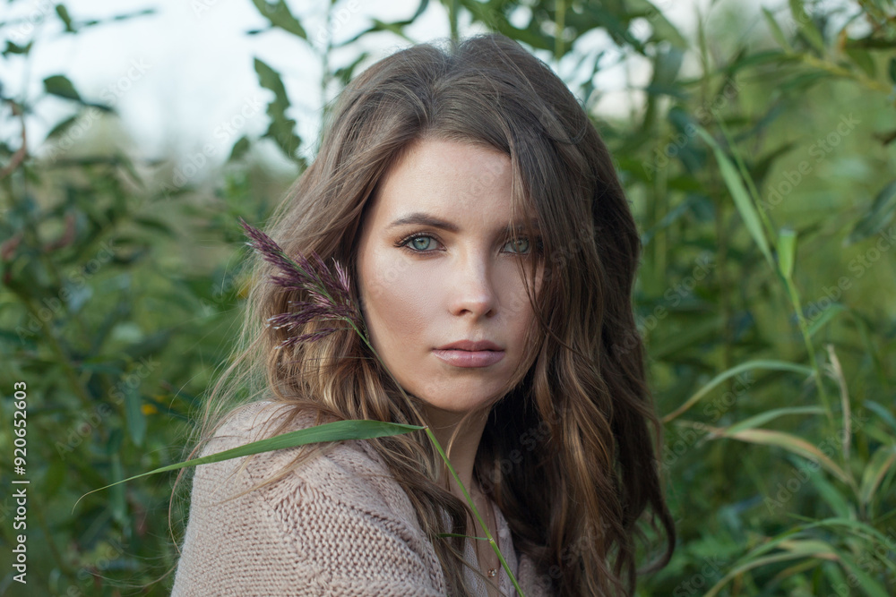 Beauty portrait of young adult female model with windy brown hair walking outdoor Beauty portrait of young adult female model with windy brown hair walking outdoor