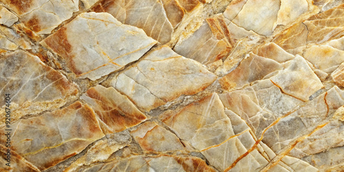 Close-up of a natural stone texture with irregular shapes and shades of brown, beige, and gold, creating a rustic and organic feel in the design