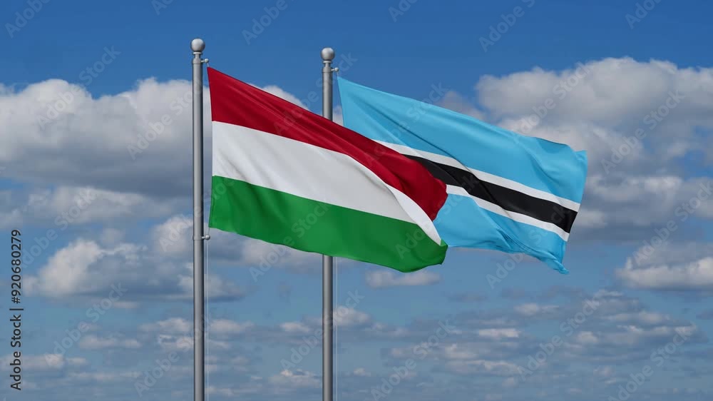 Botswana and Hungary flags flying together, video concept of the relationship, two country relations concept Botswana and Hungary flags flying together, video concept of the relationship, two country relations concept