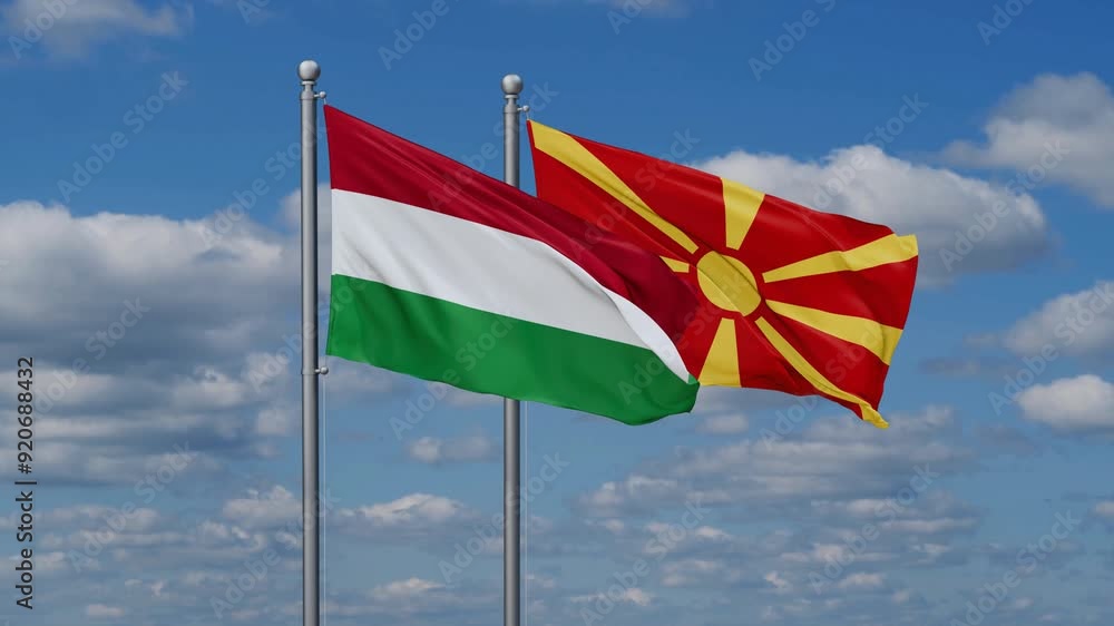 Hungary and North Macedonia flags flying together, video concept of the relationship Hungary and North Macedonia flags flying together, video concept of the relationship