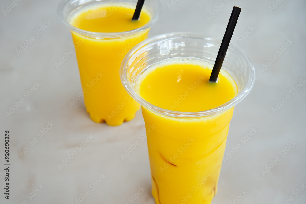 Man is drinking food from straw. fruit summer table concept. banana, straw, and drink. a fast food is a straw with a banana and a drink in it lifestyle. Man is drinking food from straw. fruit summer table concept. banana, straw, and drink. a fast food is a straw with a banana and a drink in it lifestyle.