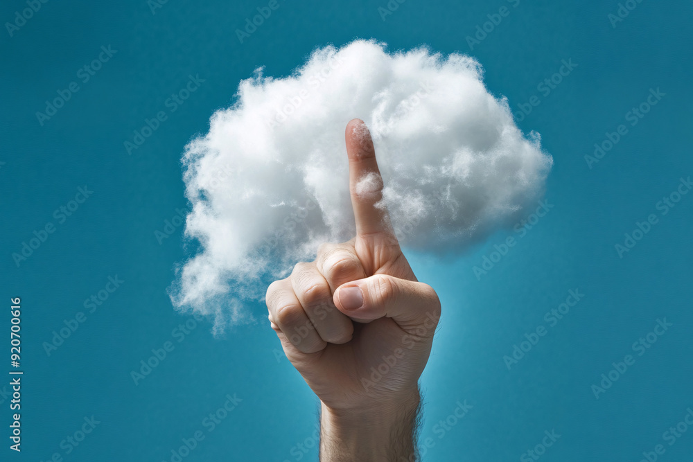 human hand reaches out and touches a small fluffy cloud against a bright blue sky creating a surreal and whimsical scene human hand reaches out and touches a small fluffy cloud against a bright blue sky creating a surreal and whimsical scene