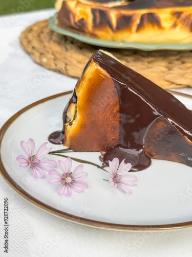 Popular Spanish cheesecake called San Sebastian cheesecake., Sliced san sebastian cheesecake with coffee on table