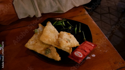 Yogyakarta, Indonesia - January 09, 2020: Delicious fried snacks at night in Alun-Alun Utara, Yogyakarta photo