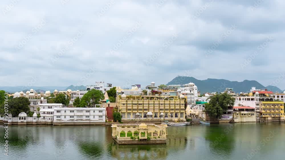 4K Time lapse of clouds moving in sky at Lake Pichola and Udaipur city. Monsoon clouds over beautiful old architecture of Udaipur, Rajasthan, India. Scenic timelapse of Lake Pichola in morning. 4K Time lapse of clouds moving in sky at Lake Pichola and Udaipur city. Monsoon clouds over beautiful old architecture of Udaipur, Rajasthan, India. Scenic timelapse of Lake Pichola in morning.