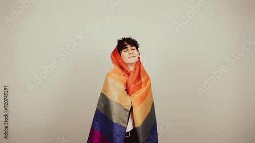 Funny guy posing with a gay flag.