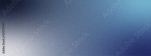 Glowing blue foil glitter metallic wall with copy space with texture. Navy blue background with light spots, rough texture, grainy noise. Smooth sanded texture closeup. 